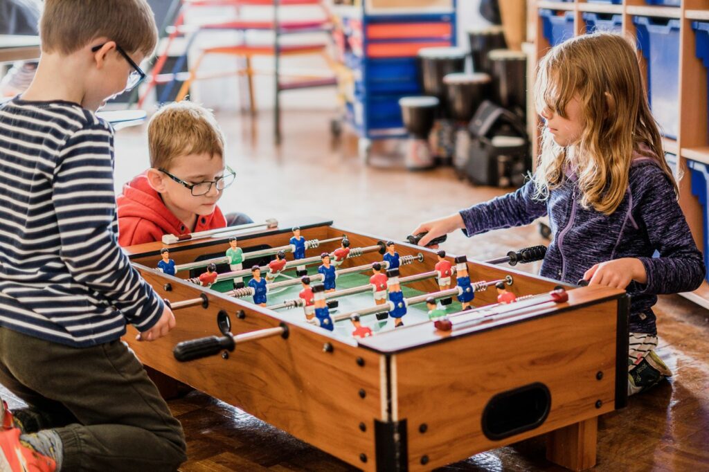 children playing table football